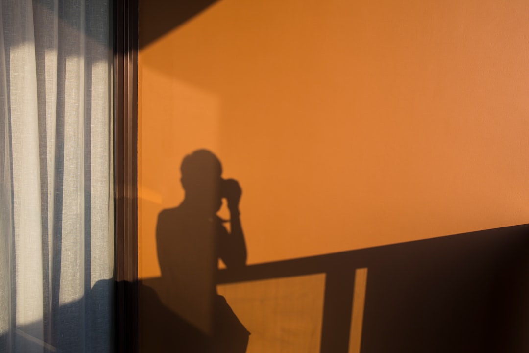 silhouette of person using camera