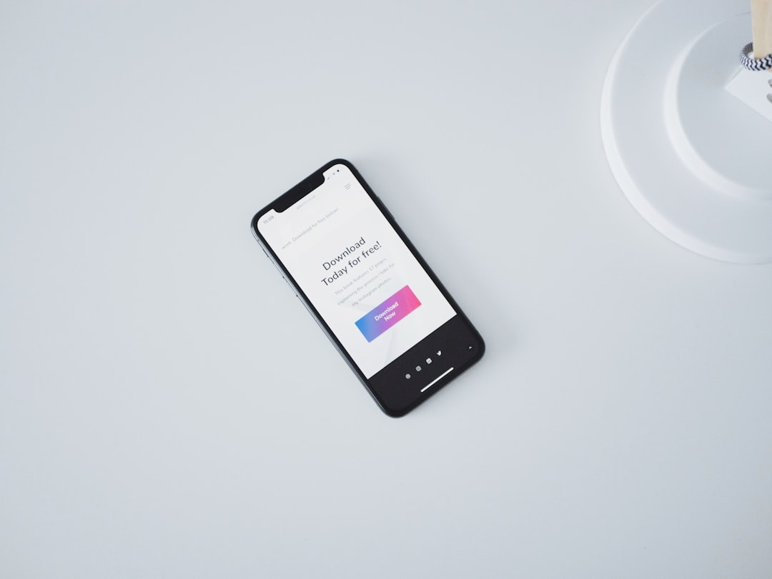 iPhone X turned on on a white surface